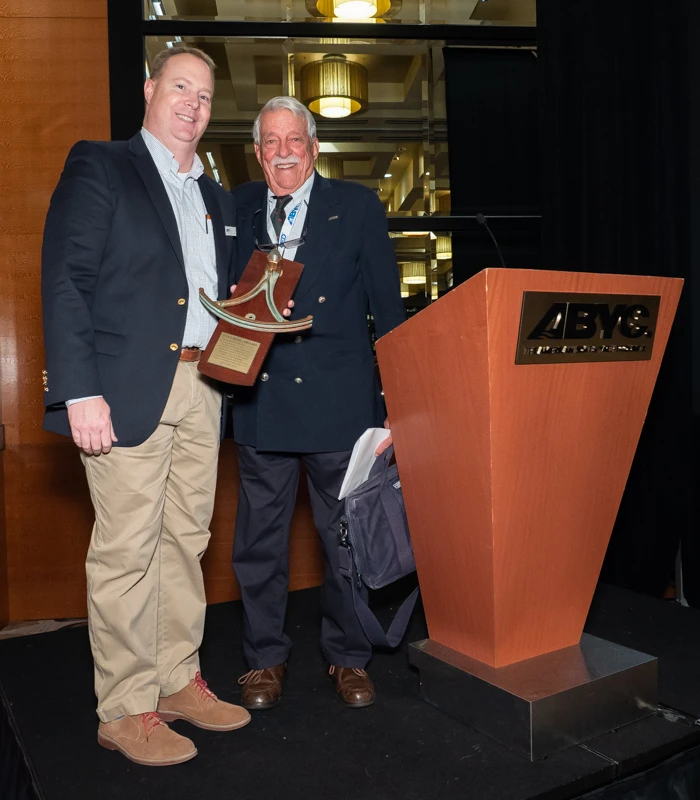 Augusto ‘Kiko’ Villalon presenting an award to ABYC President John Adey in recognition of contributions to boating safety and standards