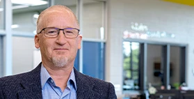 Headshot of Kyle Hewson