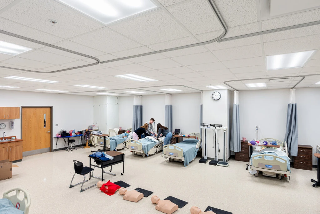 Students in Nursing Lab Room Tending to Patients at Huntington Learning Center