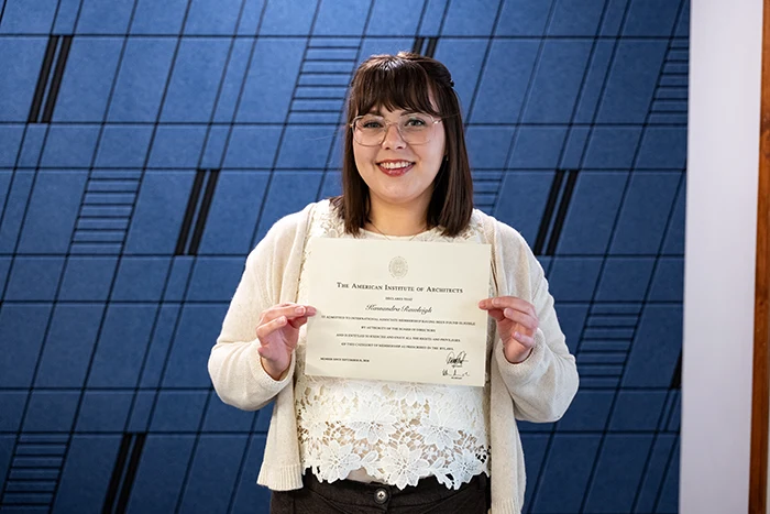 Kassandra Rawleigh holding AIA Certificate