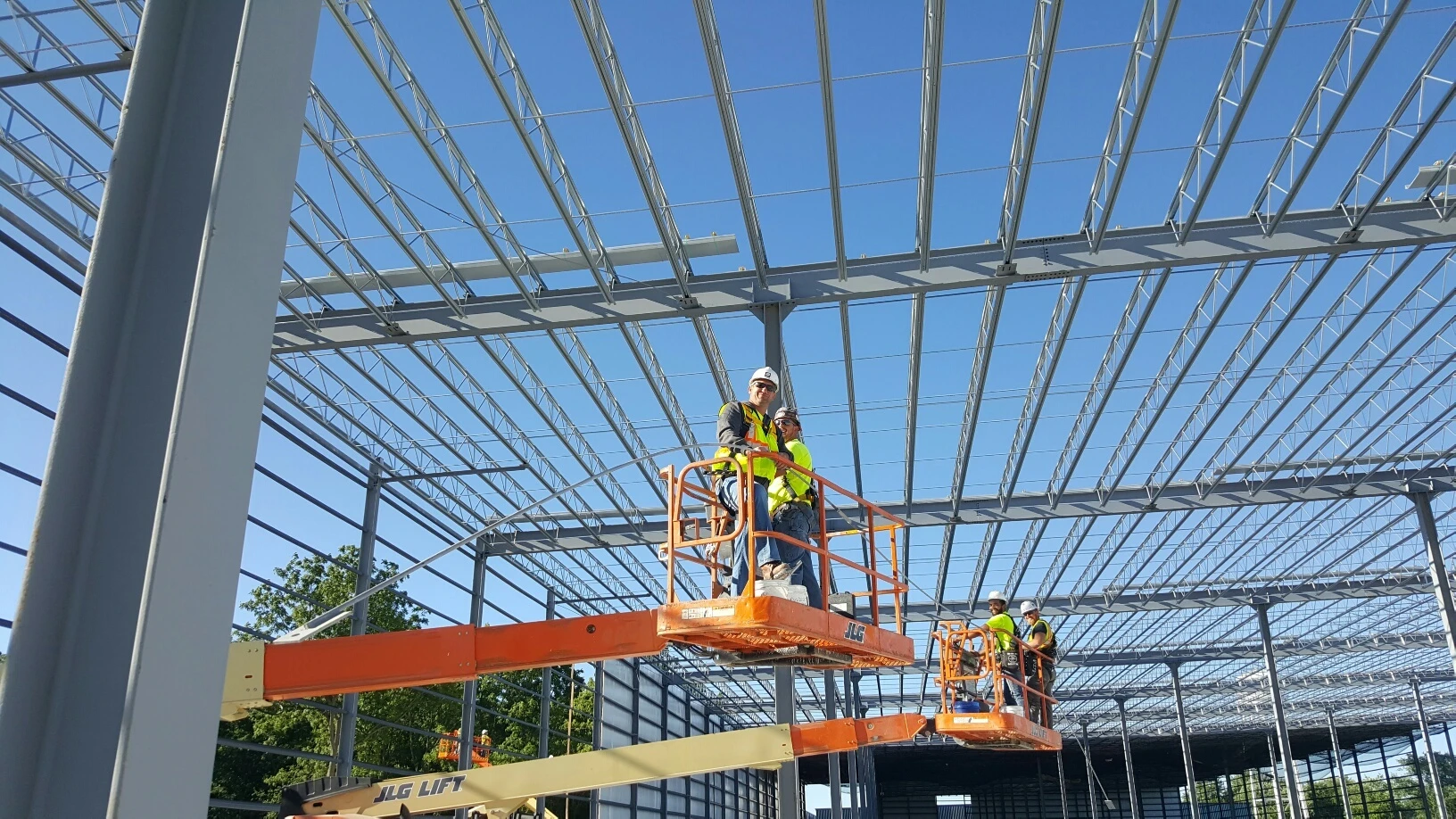 Construction worker on lift during steel construction