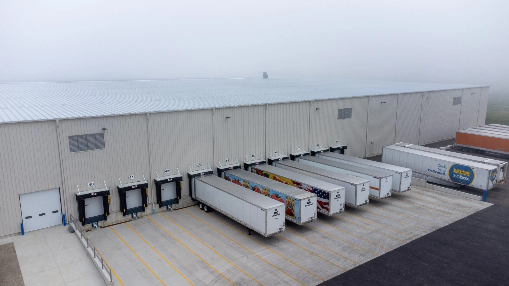Exterior of Red Gold building with trucks parked