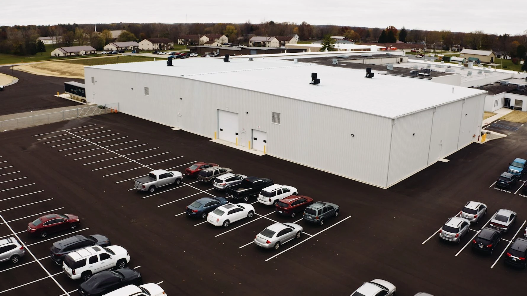 Wayne Metal completed building and parking lot full of cars