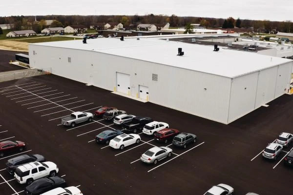 Wayne Metal completed building and parking lot full of cars
