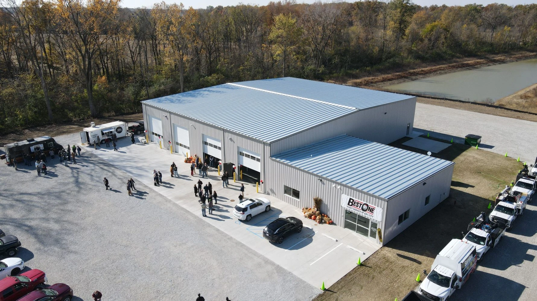 Aerial shot of completed Best Ones construction project featuring several people enjoying the open house