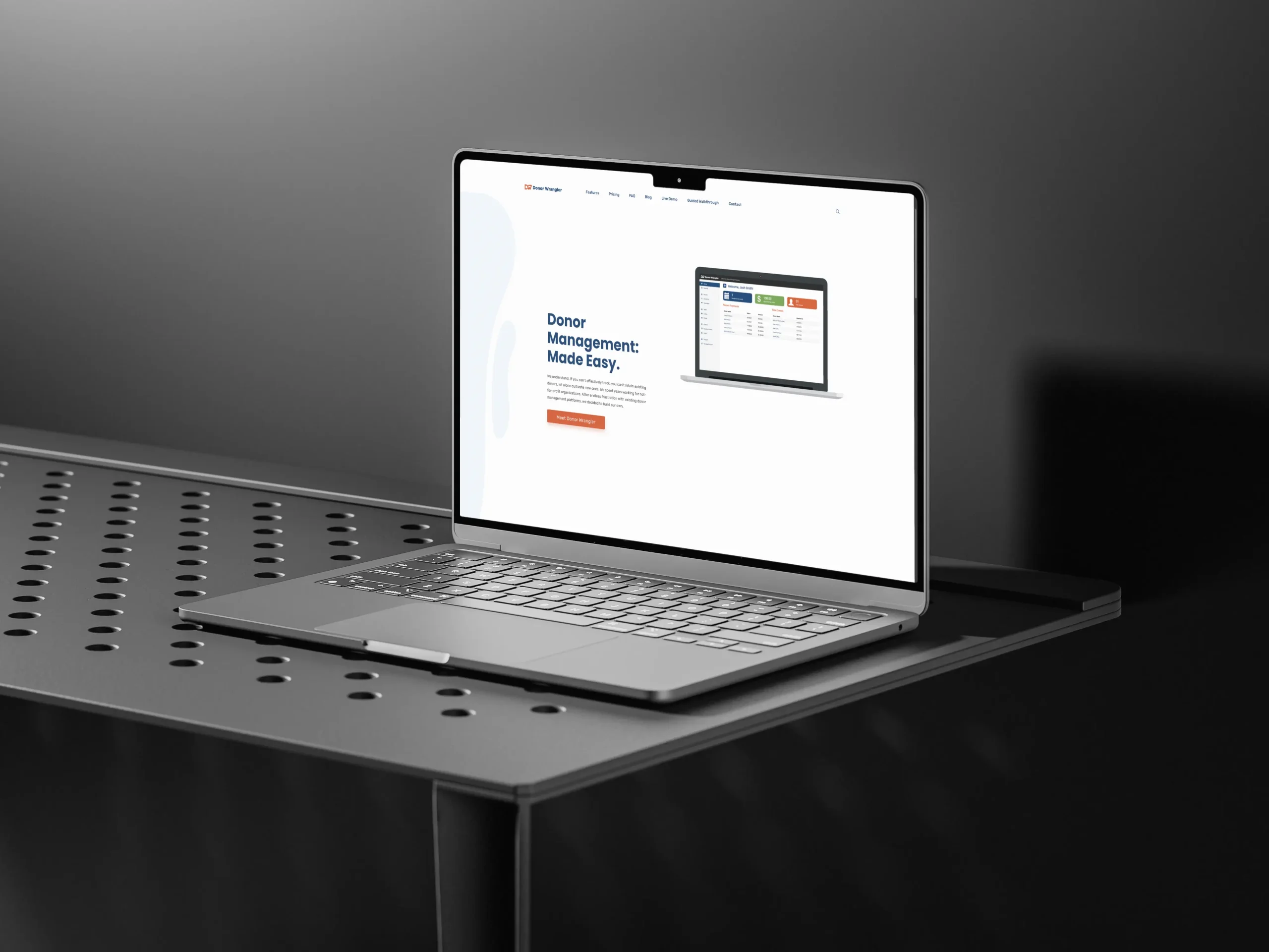 A mockup of a laptop showing the Donor Wrangler marketing website