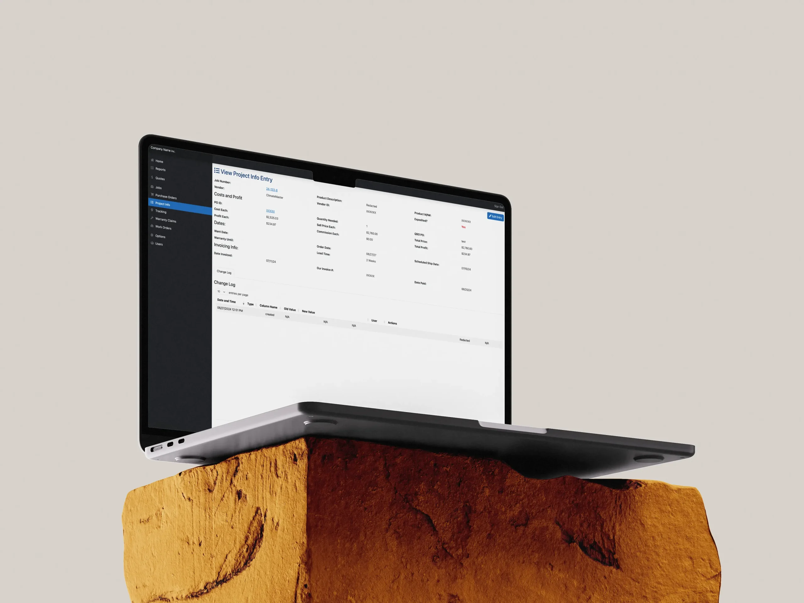 A mockup of a laptop showing the environmental services ERP system we designed