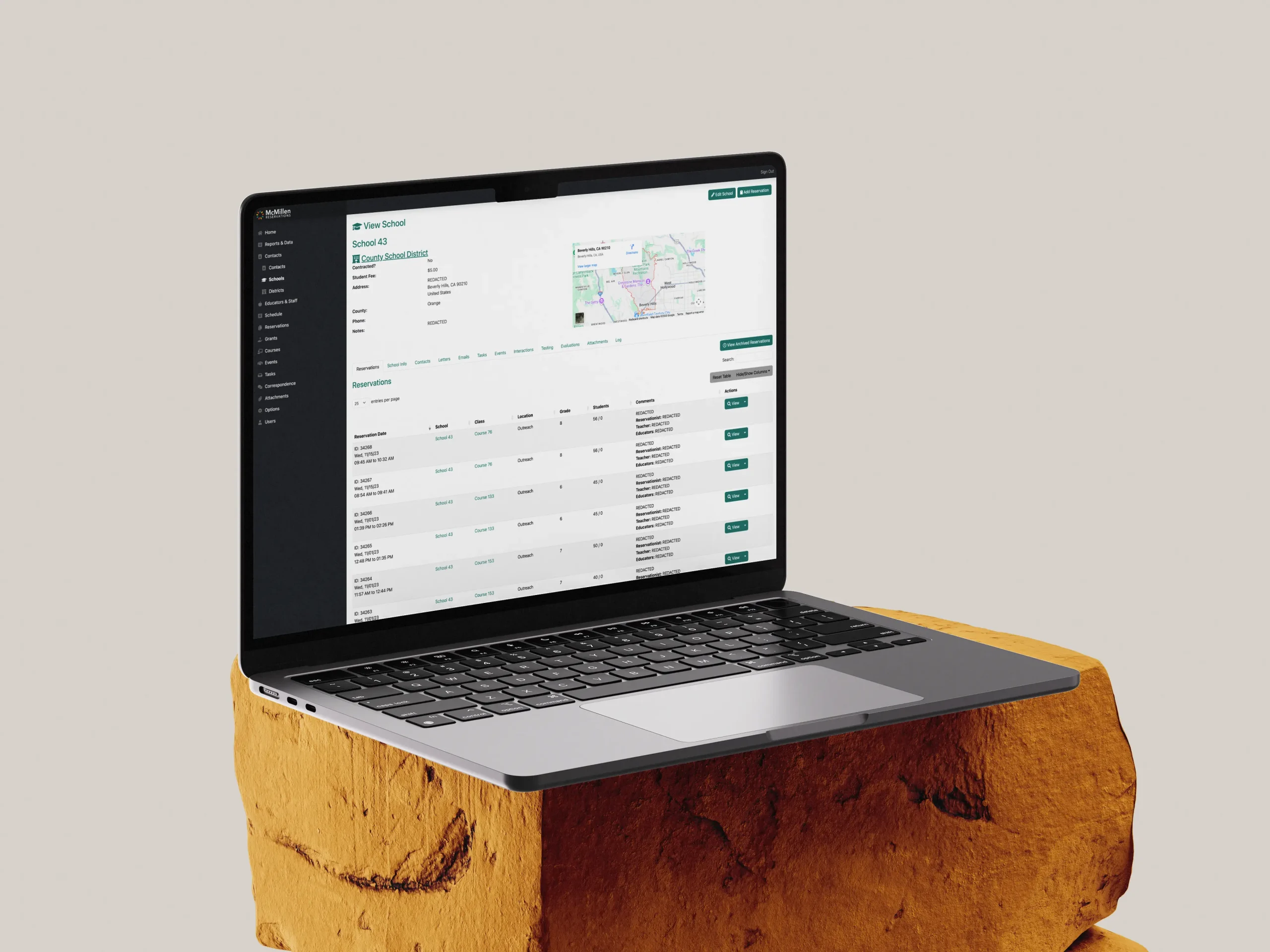 A mockup of a laptop showing the Reservation Wrangler educational center management tool