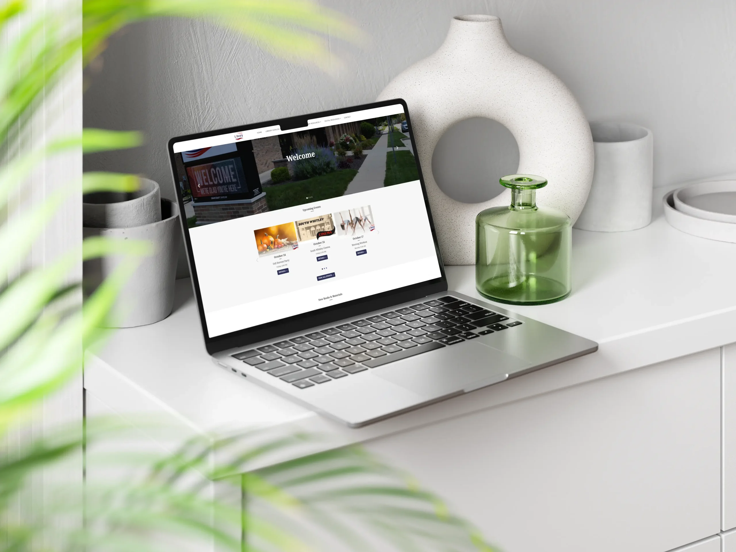 A mockup of a laptop showing the South Whitley Community Public Library website