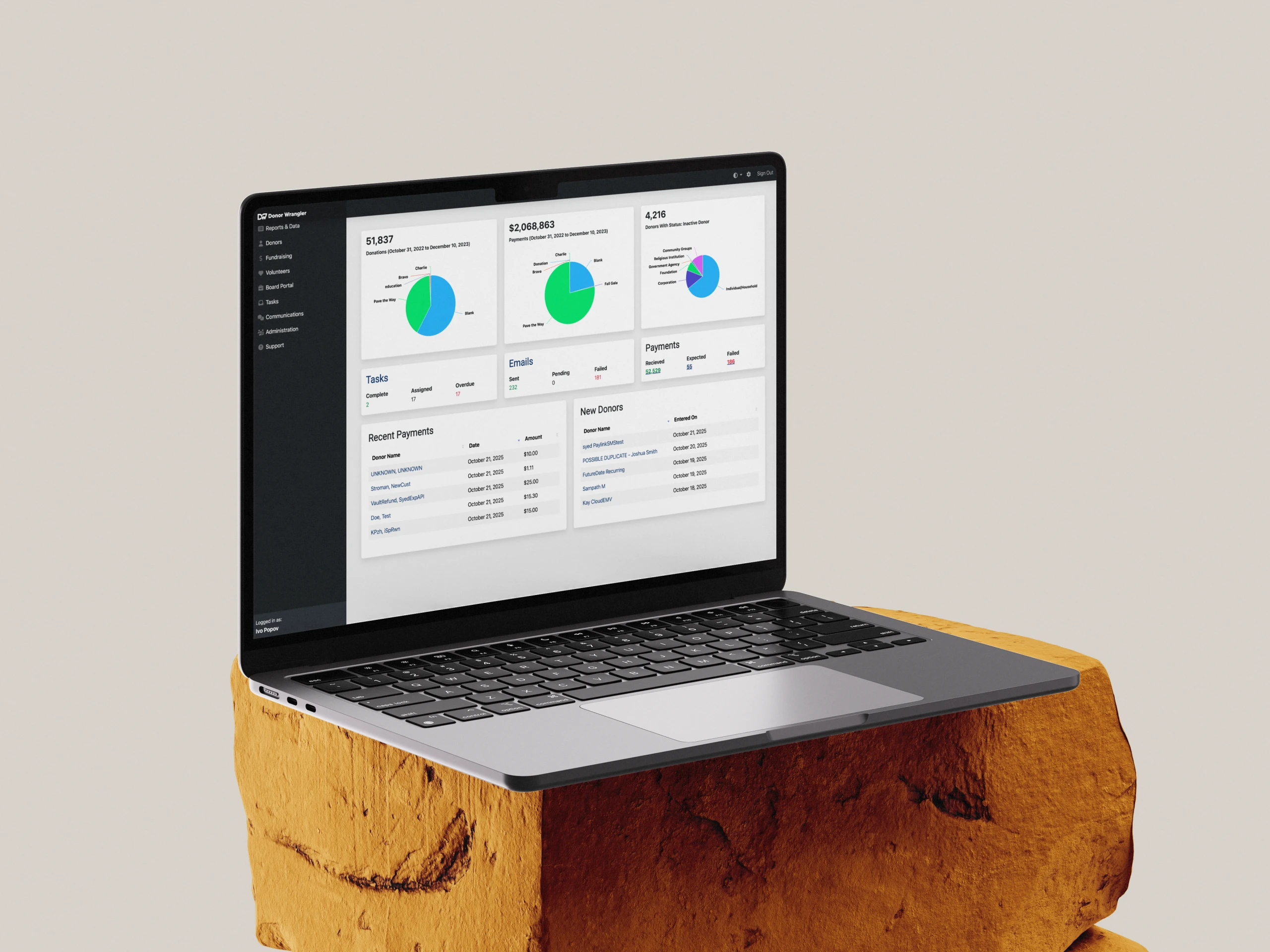 A mockup of a laptop showing the Donor Wrangler non-profit donor management system