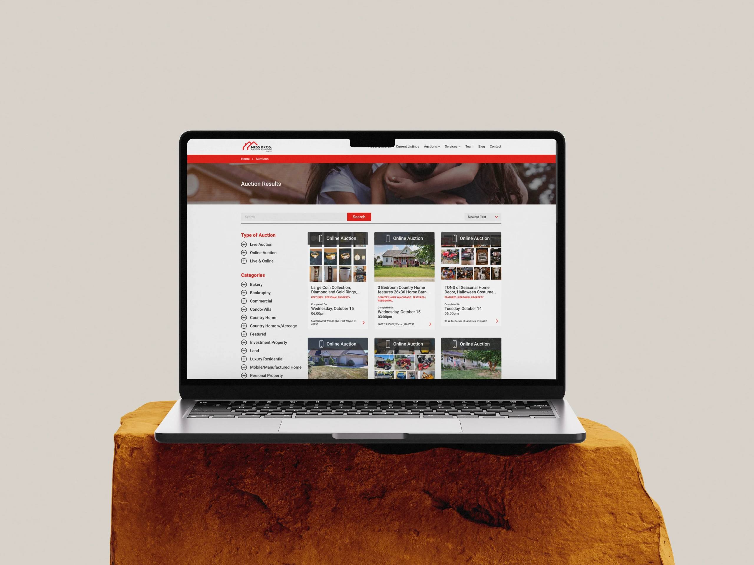 A mockup of a laptop showing the Ness Bros. website