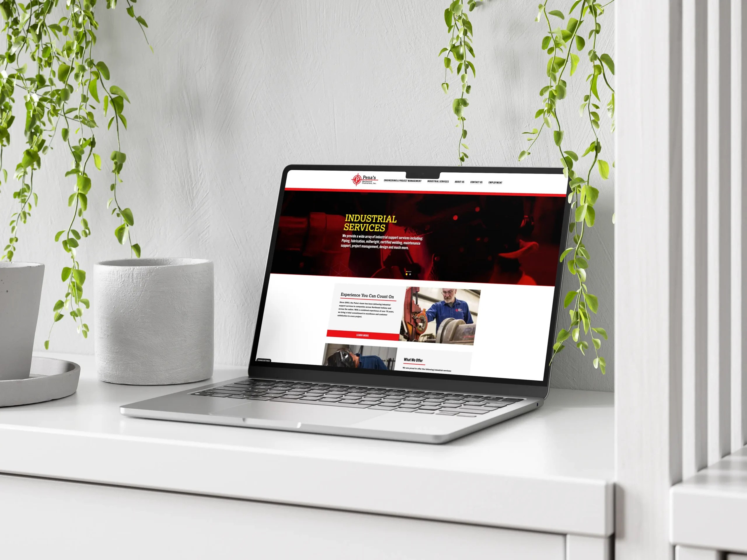 A mockup of a laptop showing the Pena Mechanical website