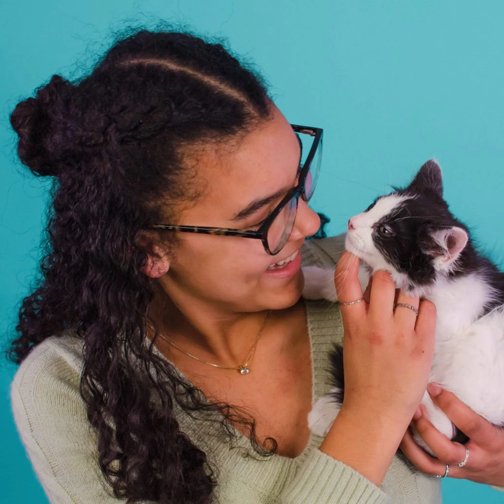 girl holding kitten