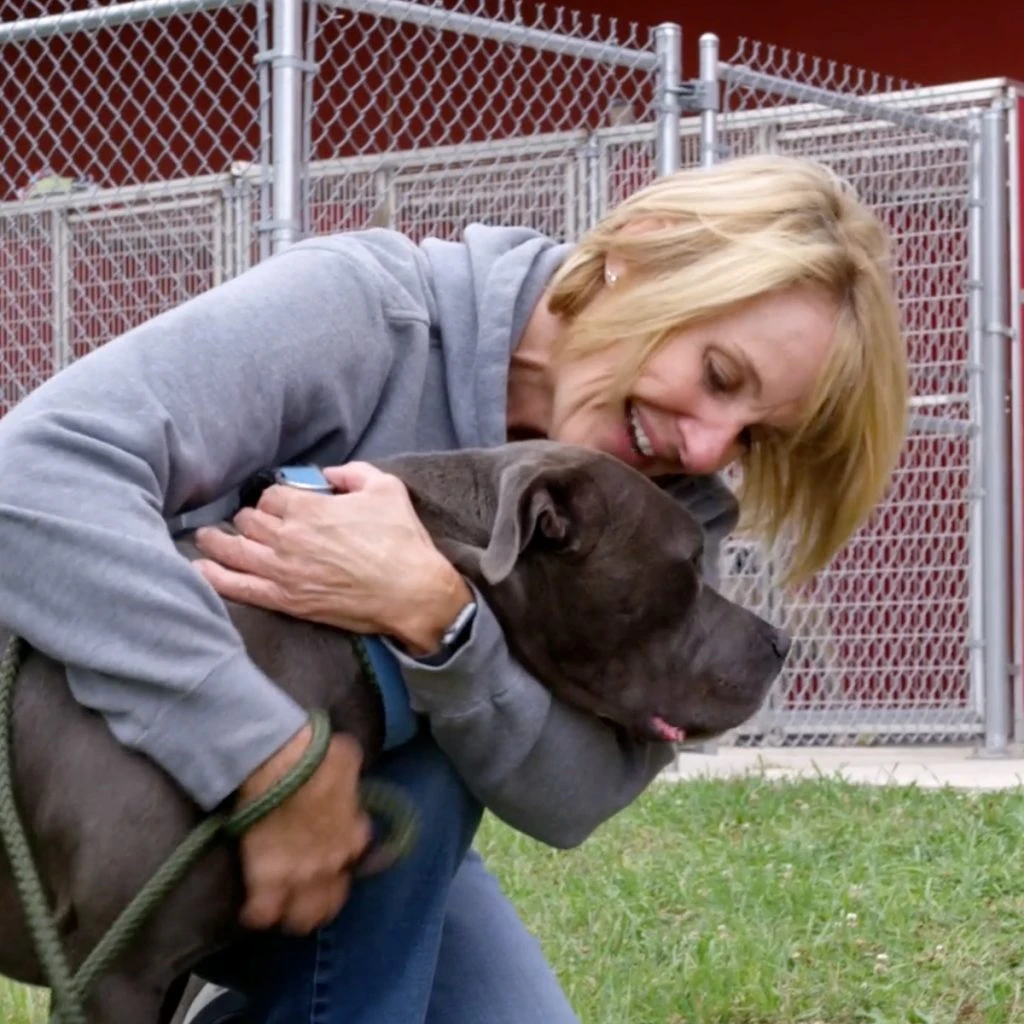 woman adopting dog from the Steuben County shelter