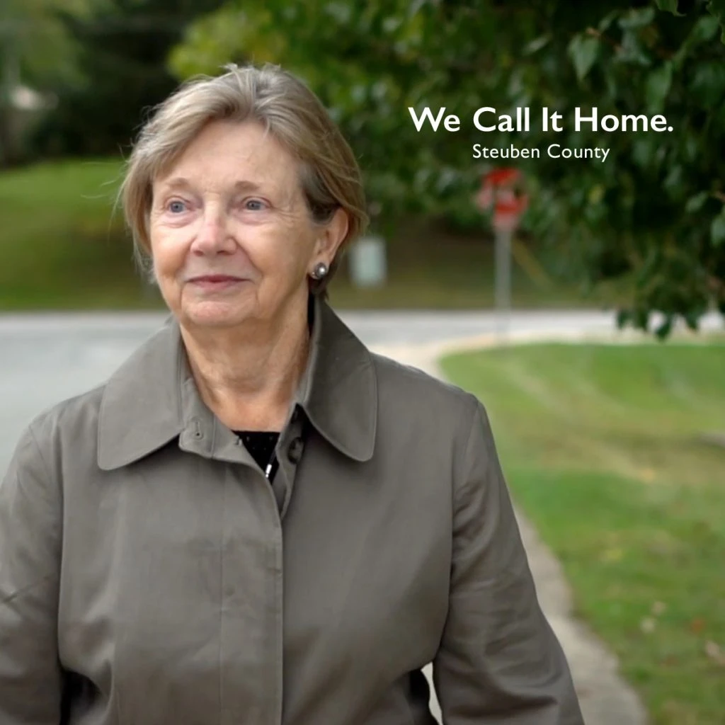 woman walking down street in Steuben County