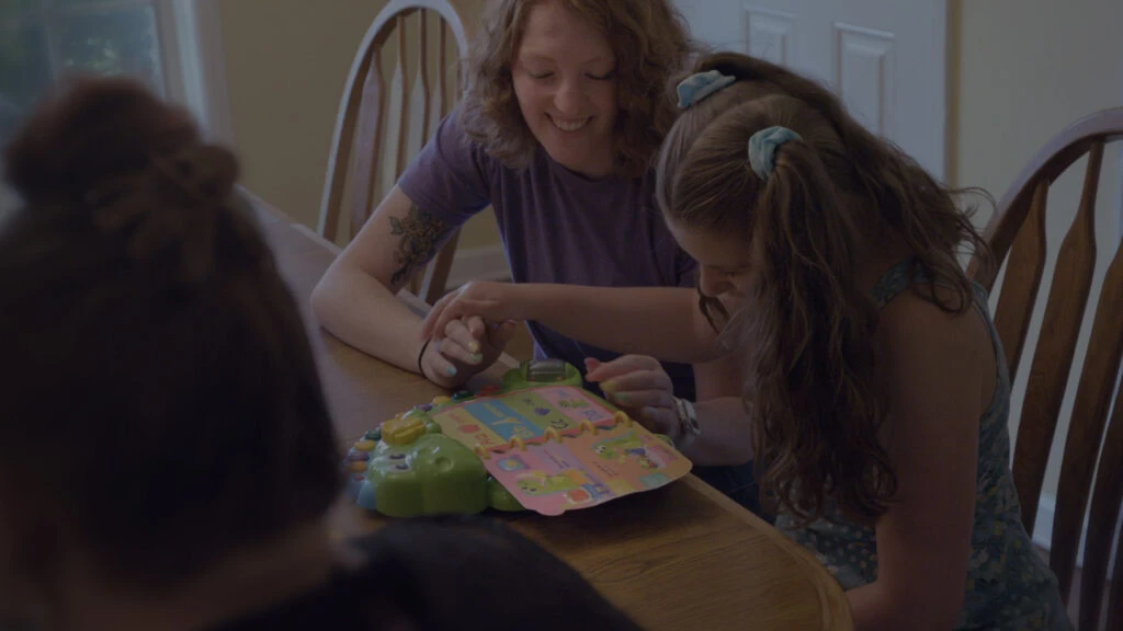 Image of parent and child playing.