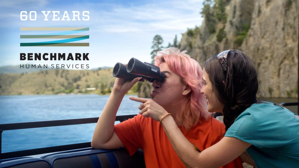 woman looking through binoculars