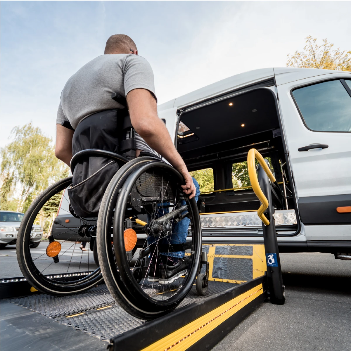 Person in wheelchair accessing a vehicle
