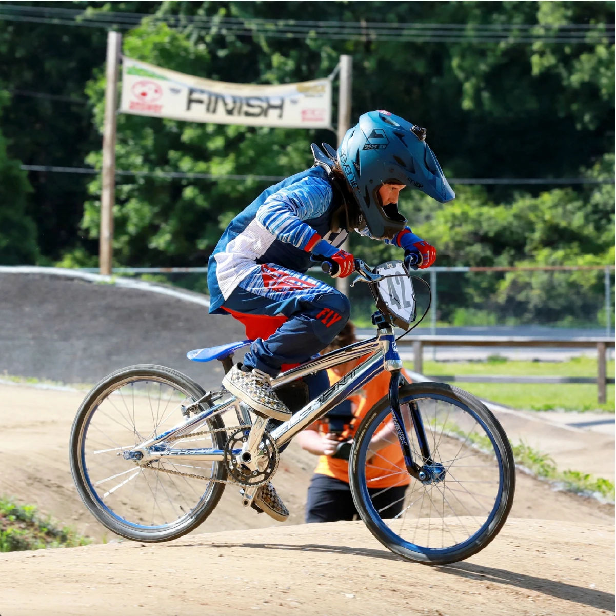 Child riding a BMX bike at the track