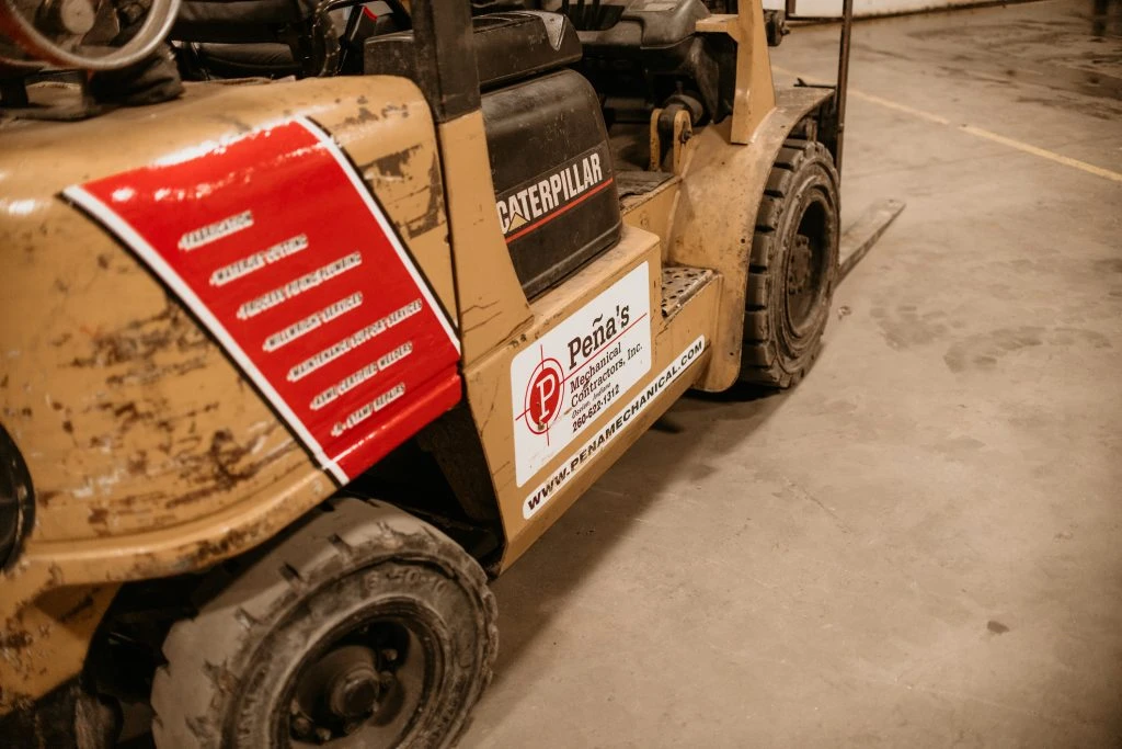 6,000# Forklift with Pena's Logo