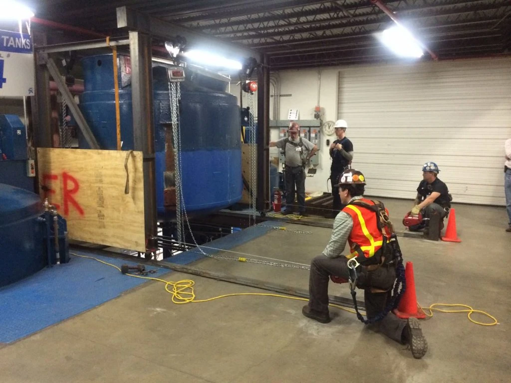 Pena's Mechanical team of skilled millwrights rigging and aligning a large industrial tank into final position