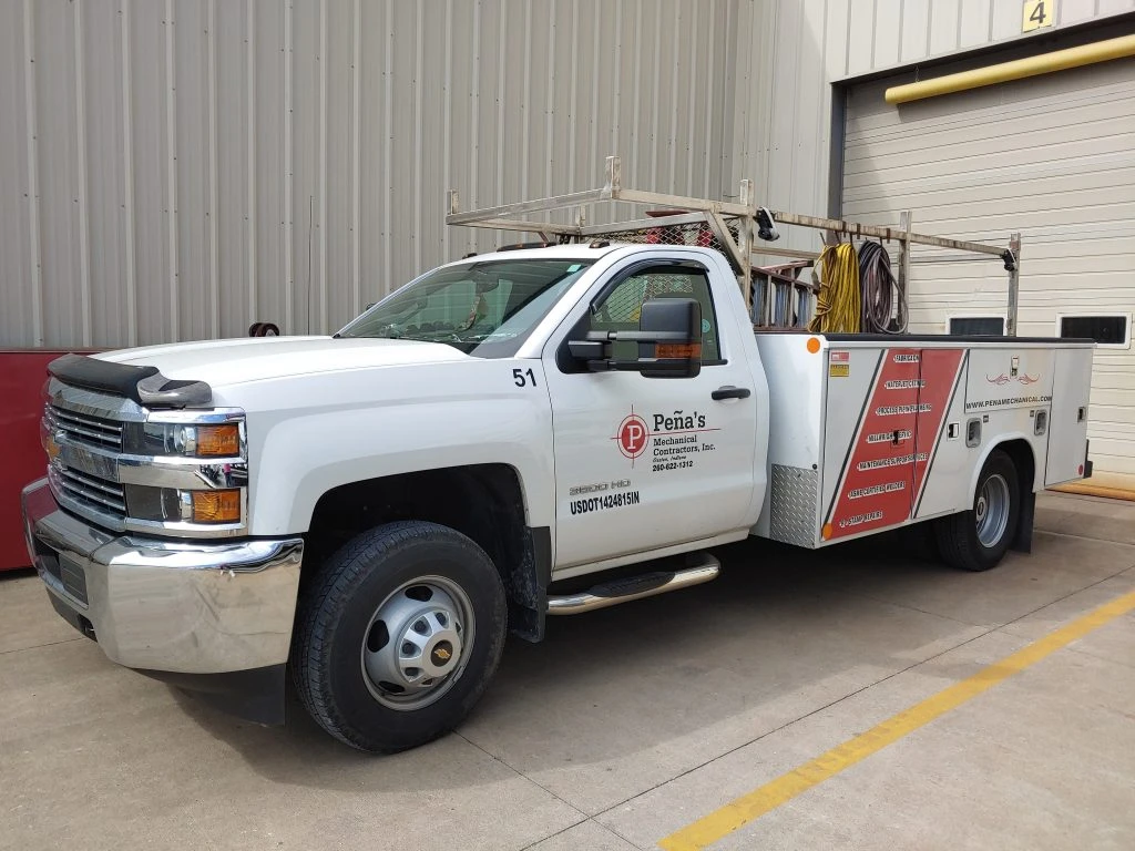 Pena's Foremans service truck with logos