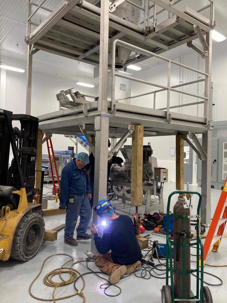 Pena's Mechanical Contractors fabricating and welding a mezzanine structure