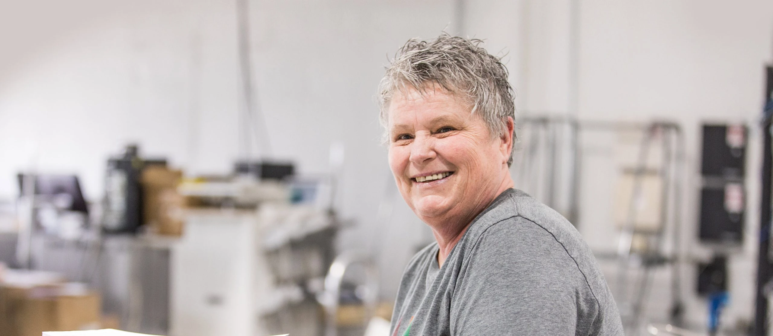 Tandem worker smiling at camera