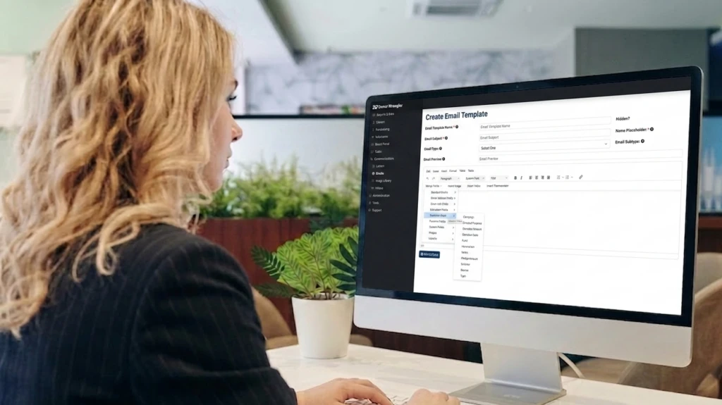 A woman generates fundraising emails using Donor Wrangler.